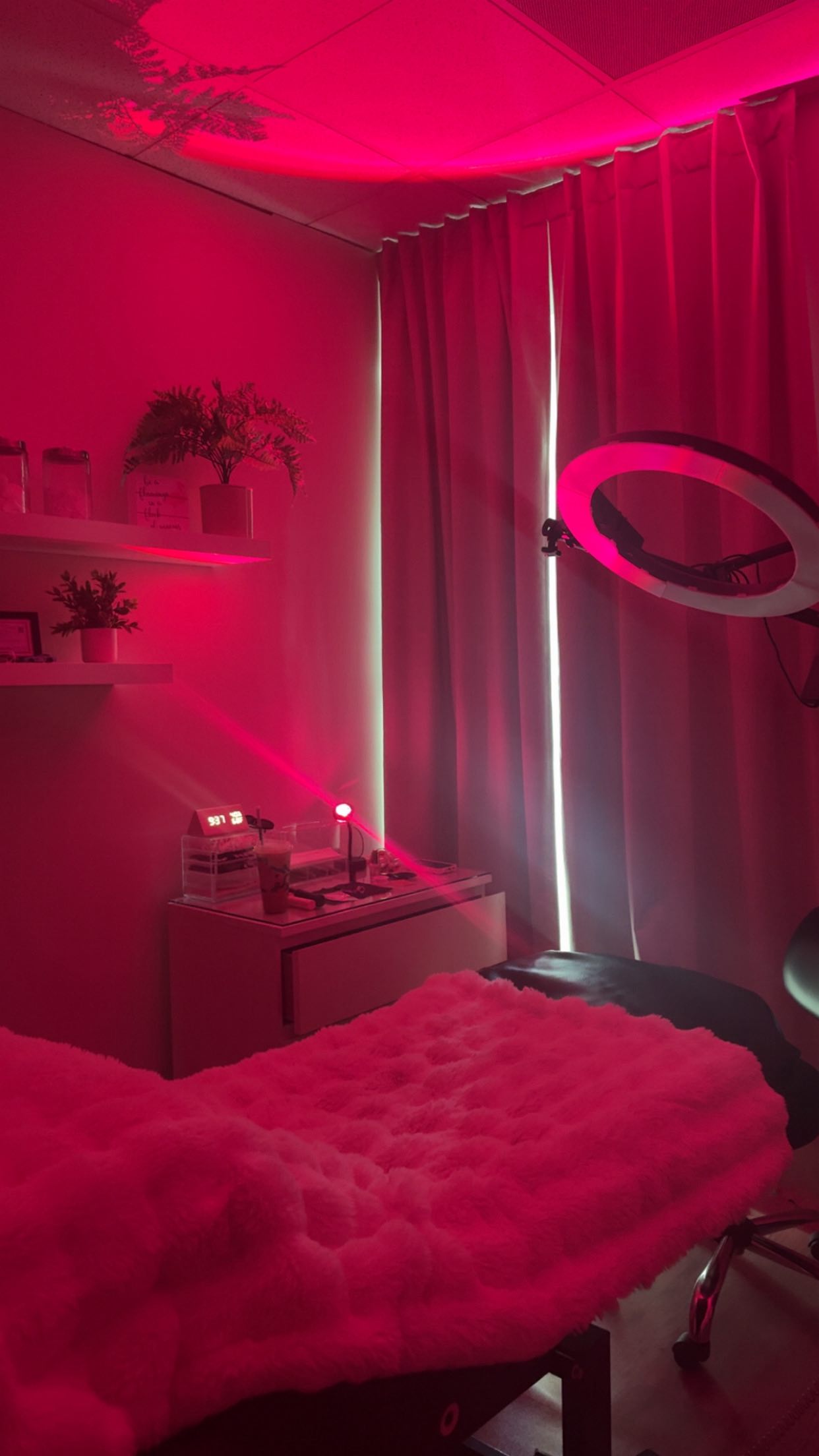 Amber's suite: treatment bed, ring light and shelves
